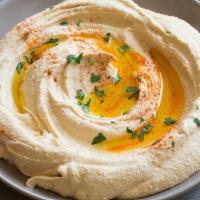 Our Signature Hummus (Large) · Puree of chickpeas, tahini, garlic and lemon juice, topped with olive oil and served with 2 ...