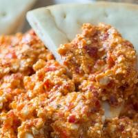 Our Signature Greek Spicy Feta Dip (Large) · Crumbled feta cheese mixed with roasted red peppers, jalapenos, oregano and a blend of spice...