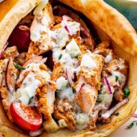 Chicken Gyro · Marinated grilled chicken tenderloin, Served on warm pita bread with lettuce, Tomatoes, Onio...