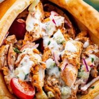 Spicy Chicken Gyro · Marinated grilled chicken tenderloin, mixed with a hot sauce, Served on warm pita bread with...