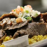 Gyro On Rice · BLEND OF BEEF & LAMB, ROASTED 
WITH SPICES, SLICED & SERVED WITH GRILLED VEGETABLES  AND ONI...