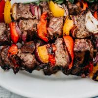 Lamb Kabob  · CUBES OF MARINATED LAMB MEAT, SKEWERED 
& GRILLED SERVED WITH VEGETABLES ON BED 
OF OUR UNIQ...
