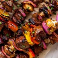 Mixed Kabob · KAFTA, LAMB & CHICKEN KABOB, SERVED WITH GRILLED VEGETABLES ON A BED OF OUR UNIQUE RICE AND ...