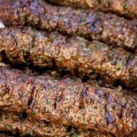 Kafta Kabob On Rice · GROUND BEEF SEASONED WITH ONIONS, PARSLEY
 & A SPECIAL BLEND OF SPICES, GRILLED & SERVED 
ON...