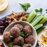 Vegetarian Dinner  · A COMBINATION PLATTER CONSISTING OF 
 FALAFEL, GREEK SALAD & STUFFED 
GRAPE LEAVES, SERVED W...