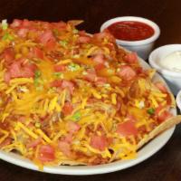Nachos · Chili, Taco Meat, Tomato, Cheese on a bed of Tortilla Chips 
*Includes Side Sour Cream and S...