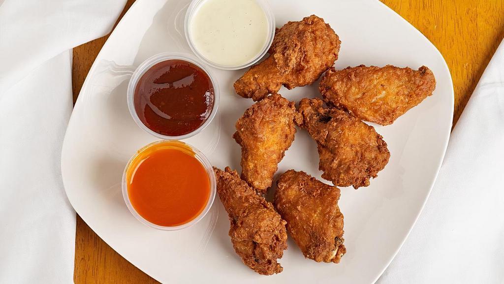 Chicken Wings · Breaded and fried spicy wings. Comes with your choice of sauce. Side includes 5 pieces and a platter includes 10.