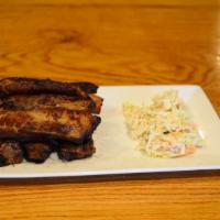 Rustic Rib · Marinated, dry rubbed ribs served with cole slaw.