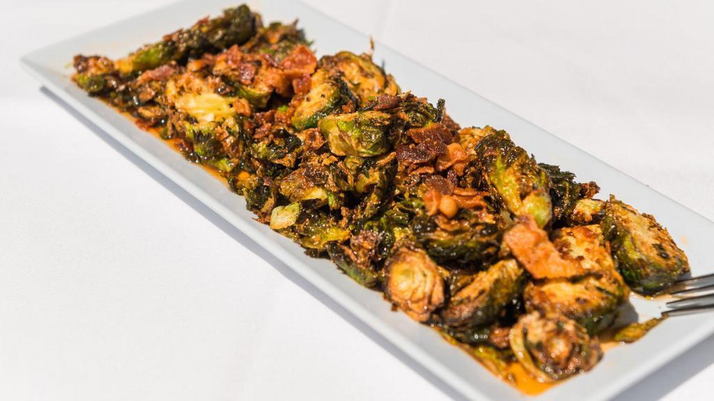 Brussel Sprouts · Tossed with bacon, honey. Sriracha, truffle salt and lime glaze. (gf).