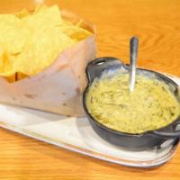 F N' P Spinach N Queso Dip · Our house recipe cheese fondue loaded with fresh spinach and tomatoes. Served with house-mad...