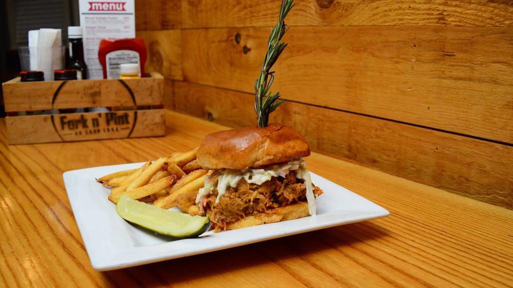 Stacked Pulled Pork · Pulled pork tossed with our f n' p sauce and topped with cole slaw.