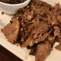 Pulled Brisket Dinner · Smoked and slow roasted pulled brisket served with your choice of two sides.