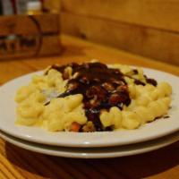 Shepards Pie Mac · Our Smoked Brisket Tossed with Creamy Cheese sauce with Cavatappi Noodles, Parnips, Potatoes...
