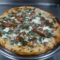 Cass Lake Sausage · Fresh sausage, spinach, fresh basil, parmesan, feta and oven roasted tomatoes.