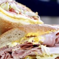 Reuben Sandwich · Lean corned beef, swiss cheese, sauerkraut on grilled rye bread with thousand island dressin...