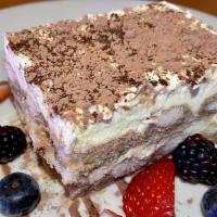 Tiramisu · A delightful coffee and mascarpone cheese cake with a hint of brandy and kahlua, topped with...