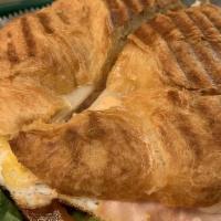 Breakfast Sandwich · Toasted croissant, chipotle mayo, spinach, tomato, fried eggs, avocado, mozzarella cheese, a...