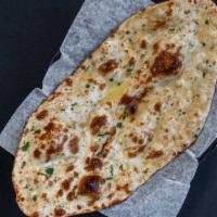 Garlic Naan · Fluffy white bread topped with fresh garlic.