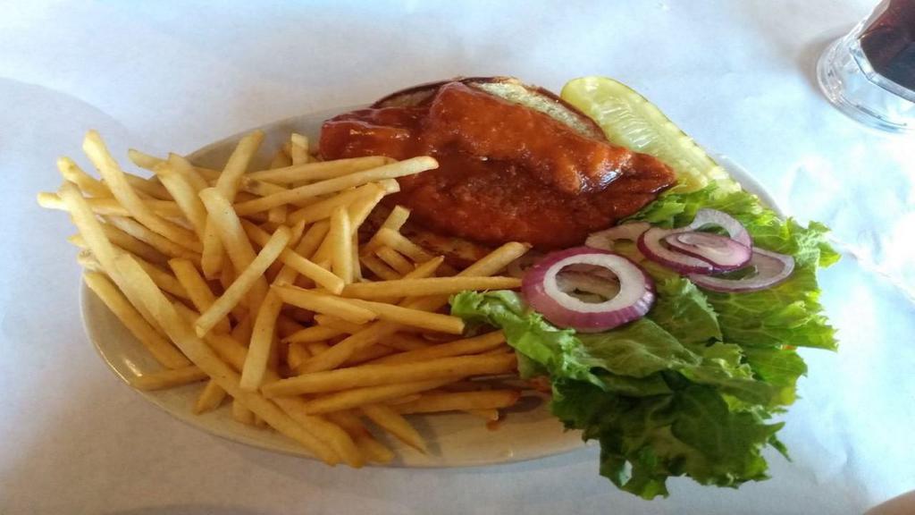 Spicy Buffalo Chicken · Breaded chicken breast tossed in buffalo sauce and topped with lettuce, tomato and onion served on a kaiser bun with a side of bleu cheese dressing.