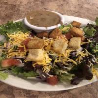 Mohawk House Salad · Vegetarian. Salad greens, red onions, tomato, Monterey jack and cheddar cheese, and garlic c...
