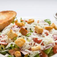 Antipasto Salad · Crisp lettuce mix topped with onions, green peppers, black olives, tomatoes, mozzarella chee...