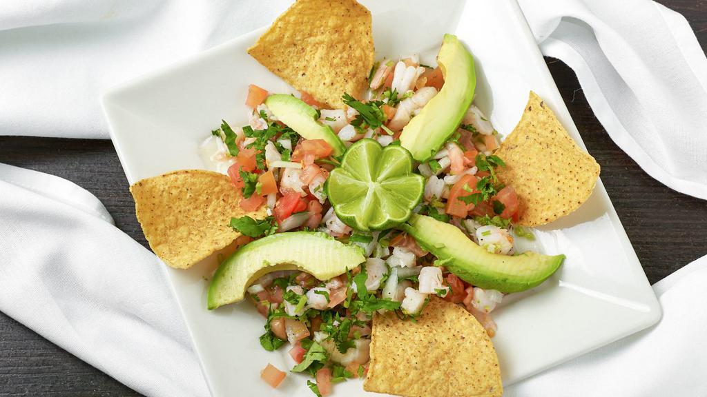 Shrimp Ceviche. · Most Popular. Fresh shrimp marinated in lime juice. Mixed with onions, tomatoes, cilantro (Pico de Gallo) and avocado. Served with homemade tortilla chips.