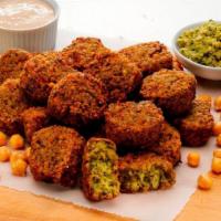 Falafel Side W/ Dip · A middle Eastern delicacy of mashed chickpeas, parsley, onion, serrano peppers then cooked i...