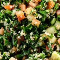 Tabouli · Handmade cracked wheat salad with fresh parsley, green onions, tomatoes, cucumbers lemon jui...