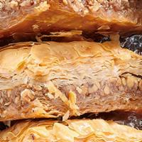 Baklava · Traditional Greek Pastry layered with flaky Filo dough, walnuts and honey