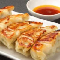 Gyoza (6Pc) · Chicken and veggies dumpling; comes with homemade garlic sauce