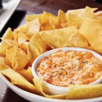 Buffalo Chicken Dip · Shredded chicken, cream cheese and buffalo sauce blended together. Served with warm tortilla...