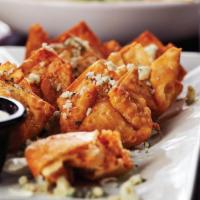 Buffalo Chicken Wontons · Crispy fried wontons filled with pockets of Big Whiskey's Buffalo Chicken Dip and sprinkled ...