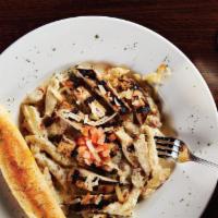 Chicken Ranch Alfredo · Our original ranch alfredo sauce tossed with penne pasta and crisp bacon. Topped with grille...