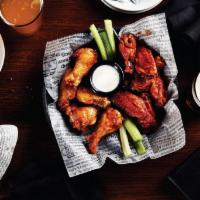 12 Classic Bone-In Wings · Big Whiskey's original award-winning jumbo wings are cooked to perfection, tossed in your ch...