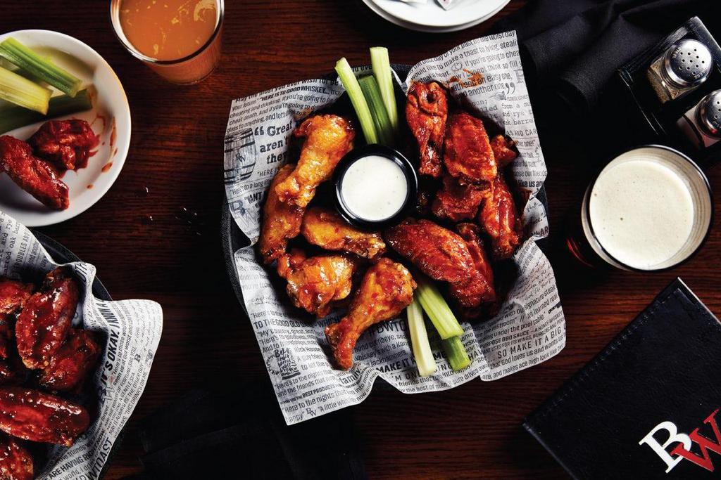 12 Classic Bone-In Wings · Big Whiskey's original award-winning jumbo wings are cooked to perfection, tossed in your choice of sauce and served with ranch or bleu cheese