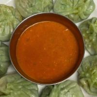 Veggie Momo Nepali Dumplings (8 Pcs) · Vegetables and dried soybean fillings marinated in Nepali spices hand-wrapped in homemade do...