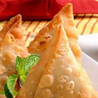 Vegetable Samosa (2 Pcs) · Vegetable (potatoes and green peas) fillings seasoned with  Nepali spices hand-wrapped in fr...