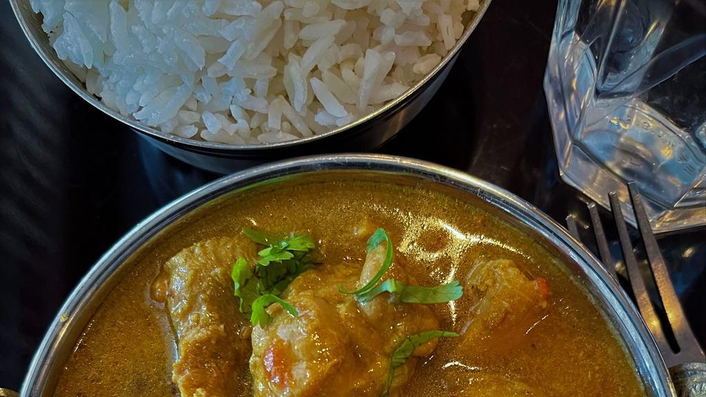 Kukhura-Ko Masu (Comes With Rice) · Chicken curry with onion, garlic, ginger, mix veggies, and special mix of aromatic spices