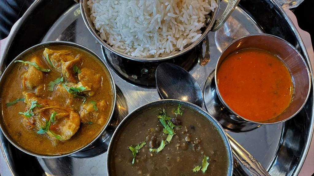 Nepali Thali (Non-Vegetarian) · Sampling of typical dishes from the Himalayan mountains of Nepal (includes Rice, Daal, and Kukhura-ko Masu)