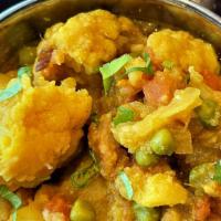 Tarkari (Comes With Rice) · Vegetables curry (potatoes, cauliflower, green peas, and tomatoes) with onion, garlic, ginge...