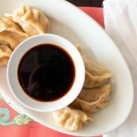 Pot Stickers (6 Pcs) · Pork and vegetable ingredients hand wrapped in hand rolled dough from scratch.