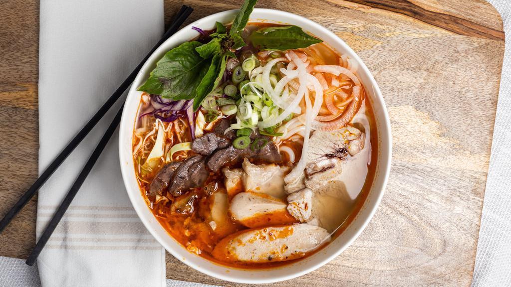 B13 Bún Bò Huế Vietnamese Spicy Beef Noodle Soup  · Thick Vermicelli Noodles in a mild lemon grass broth with brisket, flank & pork