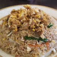 Crab Fried Rice · Fried rice with crab meat, egg, carrots, onions, tomatoes and green onions.