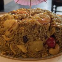 Khao Pad Sapparot / Pineapple Fried Rice · Fried jasmine rice with chicken, shrimp, pineapple, raisins, green onions, tomatoes, carrots...