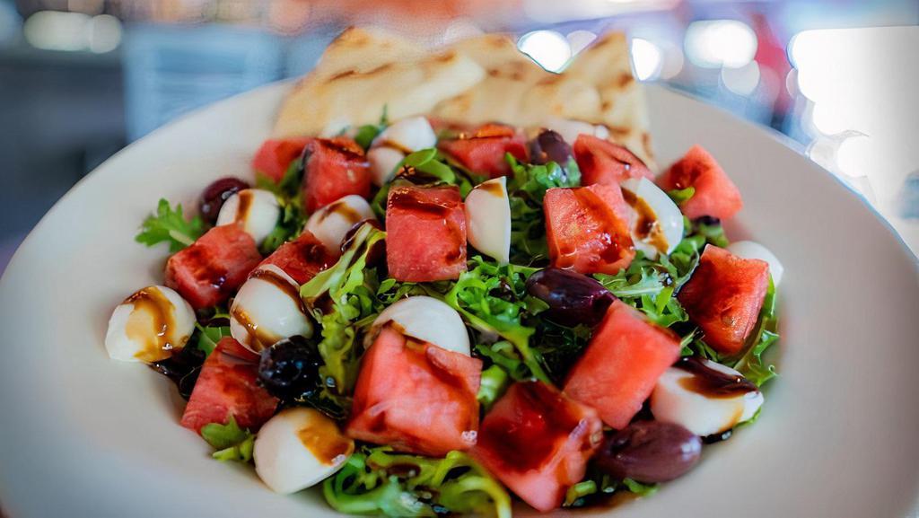 Greek Salad · ROMAINE LETTUCE, CUCUMBER, TOMATO, KALAMATA OLIVES,
BEETS, PEPPERONCINI, FETA, AND RED ONION.