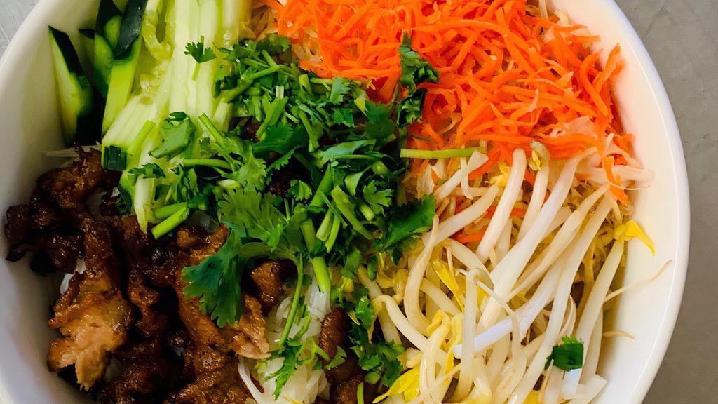Vermicelli Pork · Grilled pork slices and eggroll. Comes with vermicelli noodles, lettuce, cucumber, bean sprouts, cilantro and pickle carots, crushed peanuts.  Served with sweet fish sauce.