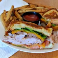 Brisket Club · smoked brisket, turkey, bacon, cheddar cheese, lettuce, tomato and mayo on thick cut grilled...