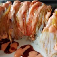 Angel Wing Roll · Hot and spicy. Shrimp tempura, avocado, cucumber inside, crabmeat on the top with spicy mayo...