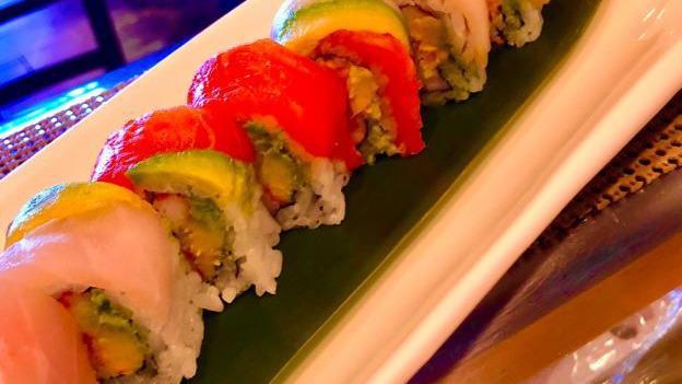 Rainbow Roll · Crab & Cucumber , Avocado Wrapped . Top w. Tuna, Salmon , White Fish & Sliced Avocado .  (No Sauce )