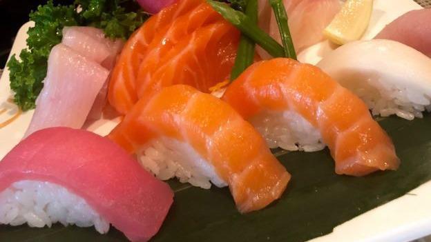 Sushi & Sashimi Combo · Served with miso soup. Five pieces sushi, nine pieces sashimi and salmon roll.